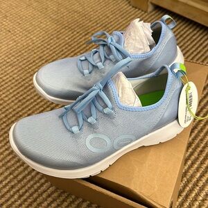 Pair of Oofos sport ls, Carolina blue sneakers
